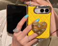 Yellow iPhone Duo with gold heart stand, detail view