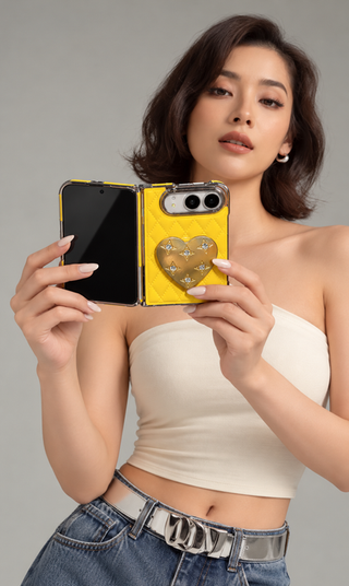 Yellow iPhone Duo with gold heart stand; inner screens visible