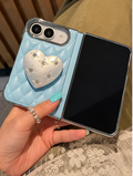 Blue iPhone Duo with silver heart stand, detail view